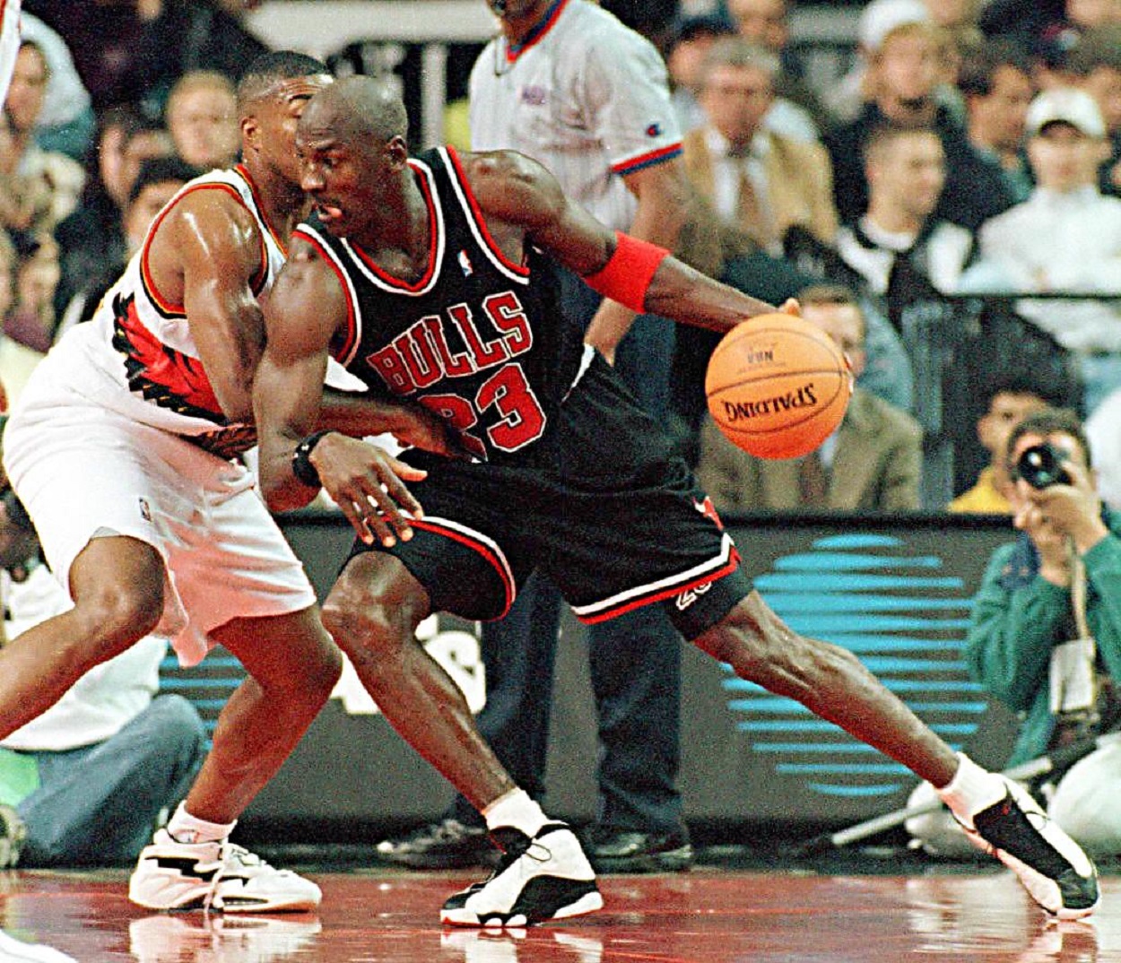 Michael Jordan of the Chicago Bulls drives to the basket against