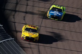 Ryan Blaney pursues Joey Logano