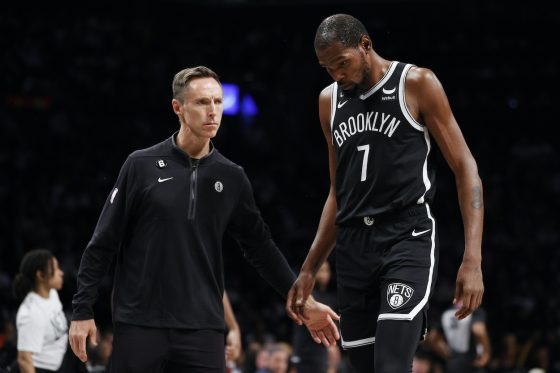 Steve Nash and Kevin Durant look on during a game.