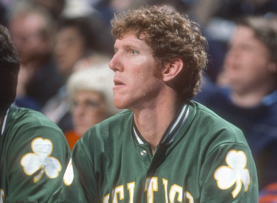 Bill Walton of the Boston Celtics looks on from the bench.