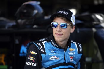 Carson Hocevar waits in the garage area during practice for the NASCAR Camping World Truck Series DoorDash 250 at Sonoma Raceway on June 10, 2022.