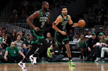 Jayson Tatum of the Boston Celtics dribbles downcourt next to Jaylen Brown during the first half of the game against the Cleveland Cavaliers at TD Garden on October 28, 2022, in Boston, Massachusetts.