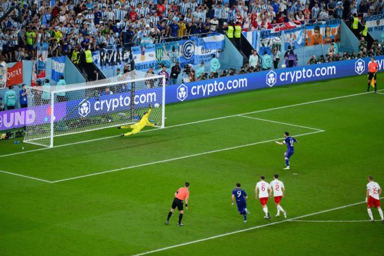 Wojciech Szczesny saves a penalty kick from Lionel Messi in the 2022 World Cup.