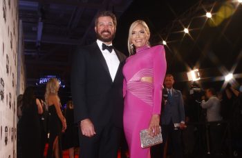 NASCAR Cup Series driver Martin Truex Jr. and Sherry Pollex pose on the red carpet prior to the NASCAR Champion's Banquet at the Music City Center on Dec. 2, 2021 in Nashville, Tennessee.