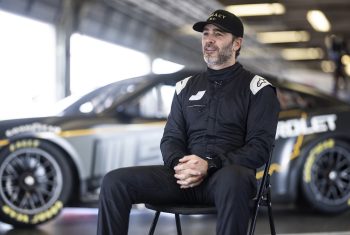 Jimmie Johnson is interviewed in the garage during the NASCAR Garage 56 test at Daytona International Speedway on Jan. 31, 2023.