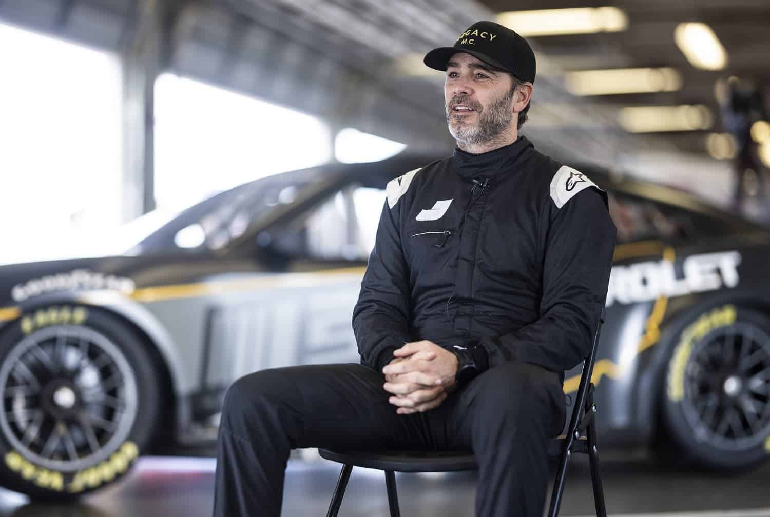 Jimmie Johnson is interviewed in the garage during the NASCAR Garage 56 test at Daytona International Speedway on Jan. 31, 2023. | James Gilbert/Getty Images