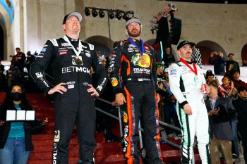 Kyle Busch, Martin Truex Jr., and Austin Dillon pose for photos