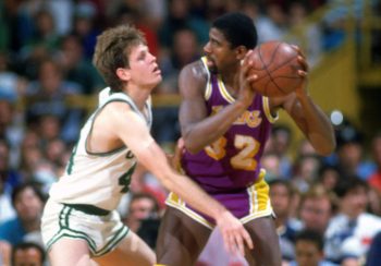 Danny Ainge of the Boston Celtics guards Magic Johnson.