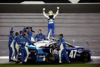 Ricky Stenhouse Jr. (C) celebrates after winning the 2023 Daytona 500.