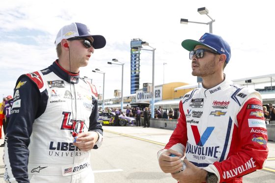 William Byron and Kyle Larson of Hendrick Motorsports talk on the grid during qualifying for the NASCAR Cup Series Dixie Vodka 400 at Homestead-Miami Speedway on Oct. 22, 2022.