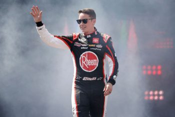 Christopher Bell waves to the crowd ahead of the NASCAR Cup Series Toyota Owners 400 at Richmond Raceway.