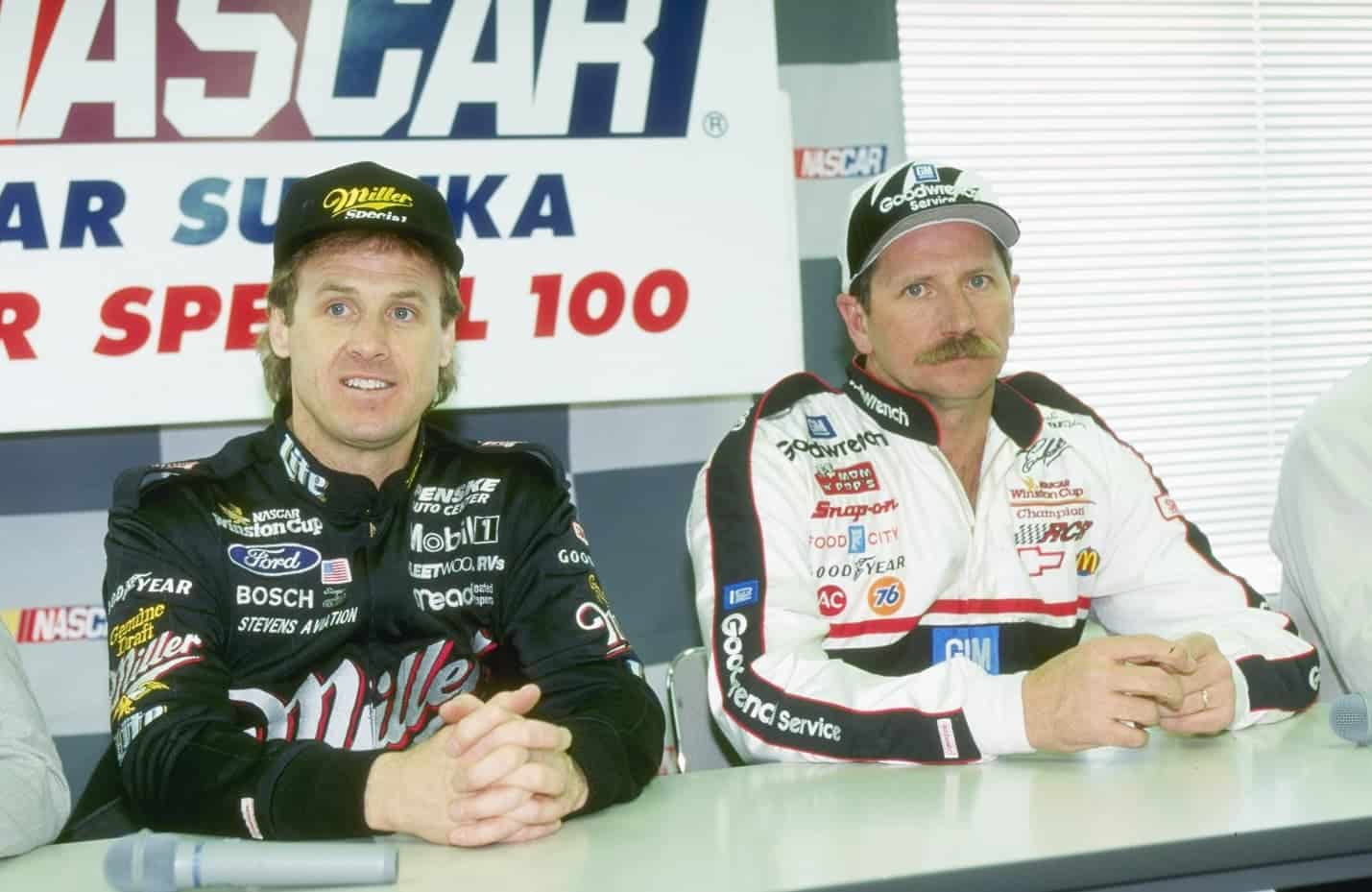 Rusty Wallace and Dale Earnhardt sit at a news conference at the Goodyear Tire Test in Sukaza, Japan, in 1996. | Allsport via Getty Images