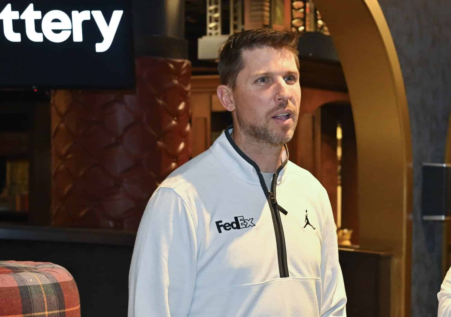 NASCAR driver Denny Hamlin during an appearance with PGA Tour star Rory McIlroy on May 2, 2023 in Charlotte, North Carolina. | Ben Jared/PGA Tour via Getty Images