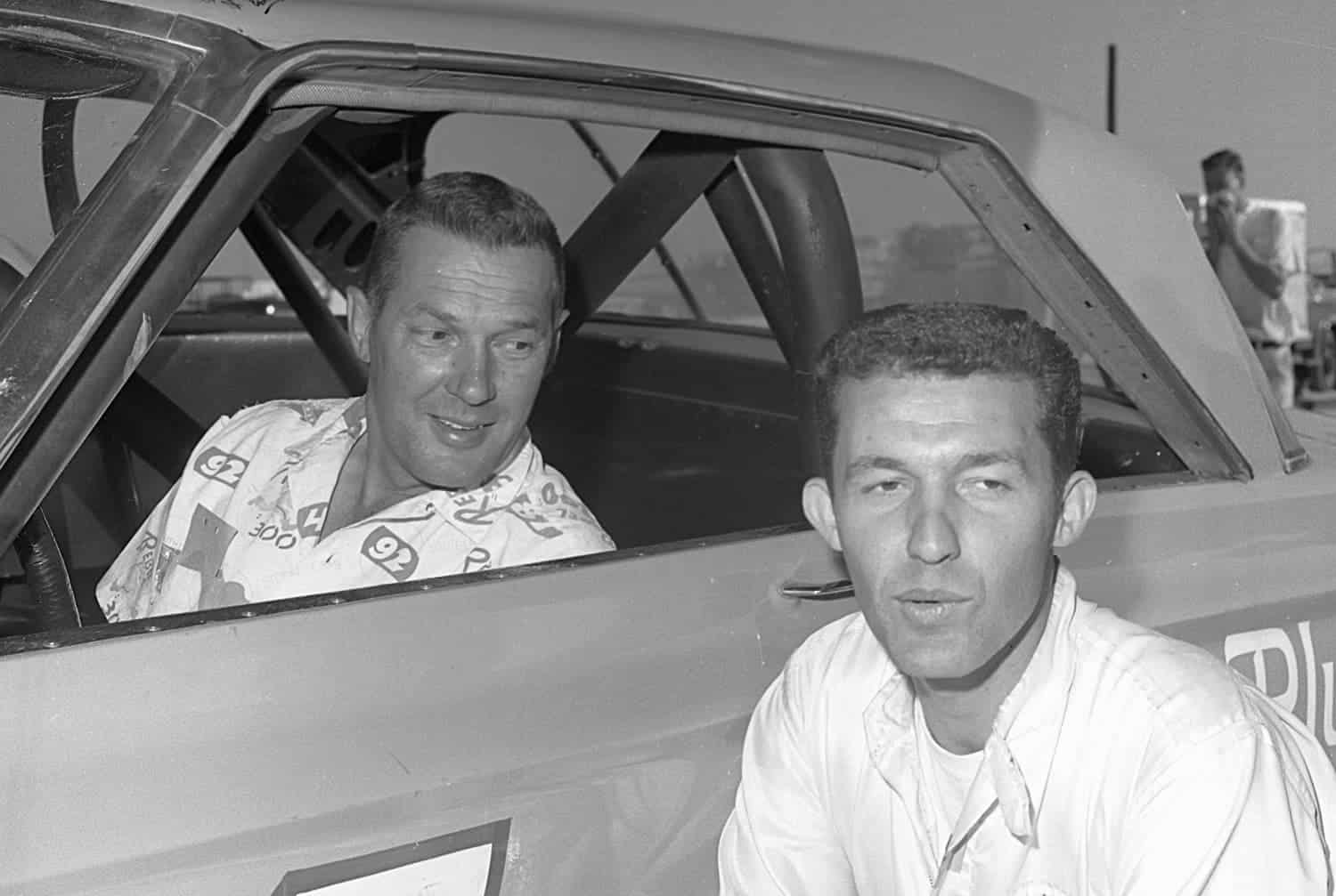 Jim Paschal (in car) and Richard Petty pose for a photo during the 1965 NASCAR season. Petty Enterprises hired Paschal to drive in three races, and he responded by finishing no worse than fifth.|  ISC Images & Archives via Getty Images