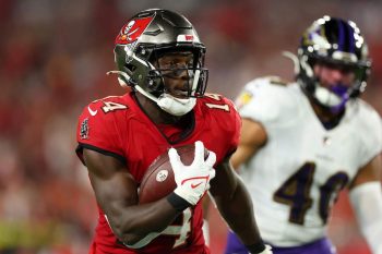 Tampa Bay Buccaneers player Chris Godwin runs with the football