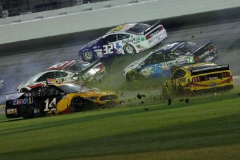 Clint Bowyer, driver of the #14 Rush/Mobil 1 Ford, and Michael McDowell, driver of the #34 Love's Travel Stops Ford, crash during the NASCAR Cup Series Daytona 500 on Feb. 17, 2020