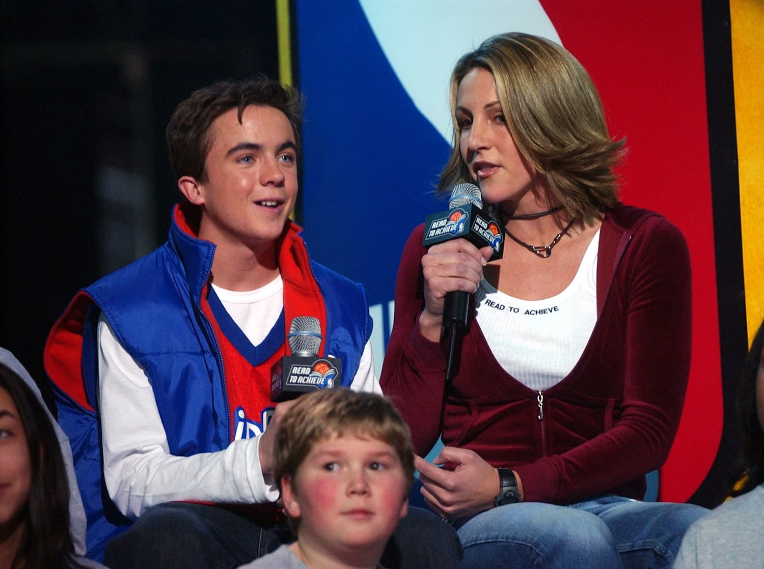 A young Frankie Muniz and Summer Sanders, co-host of NBA Inside Stuff, at the NBA All-Star Read to Achieve Celebration in Philadelphia on Feb. 9, 2002. | KMazur/WireImage via Getty Images