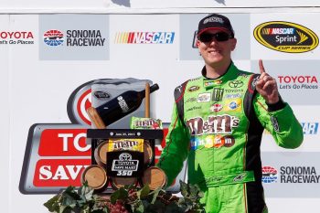 Kyle Busch, driver of the #18 M&M's Crispy Toyota, poses with the trophy after winning the NASCAR Sprint Cup Series Toyota/Save Mart 350 at Sonoma Raceway on June 28, 2015