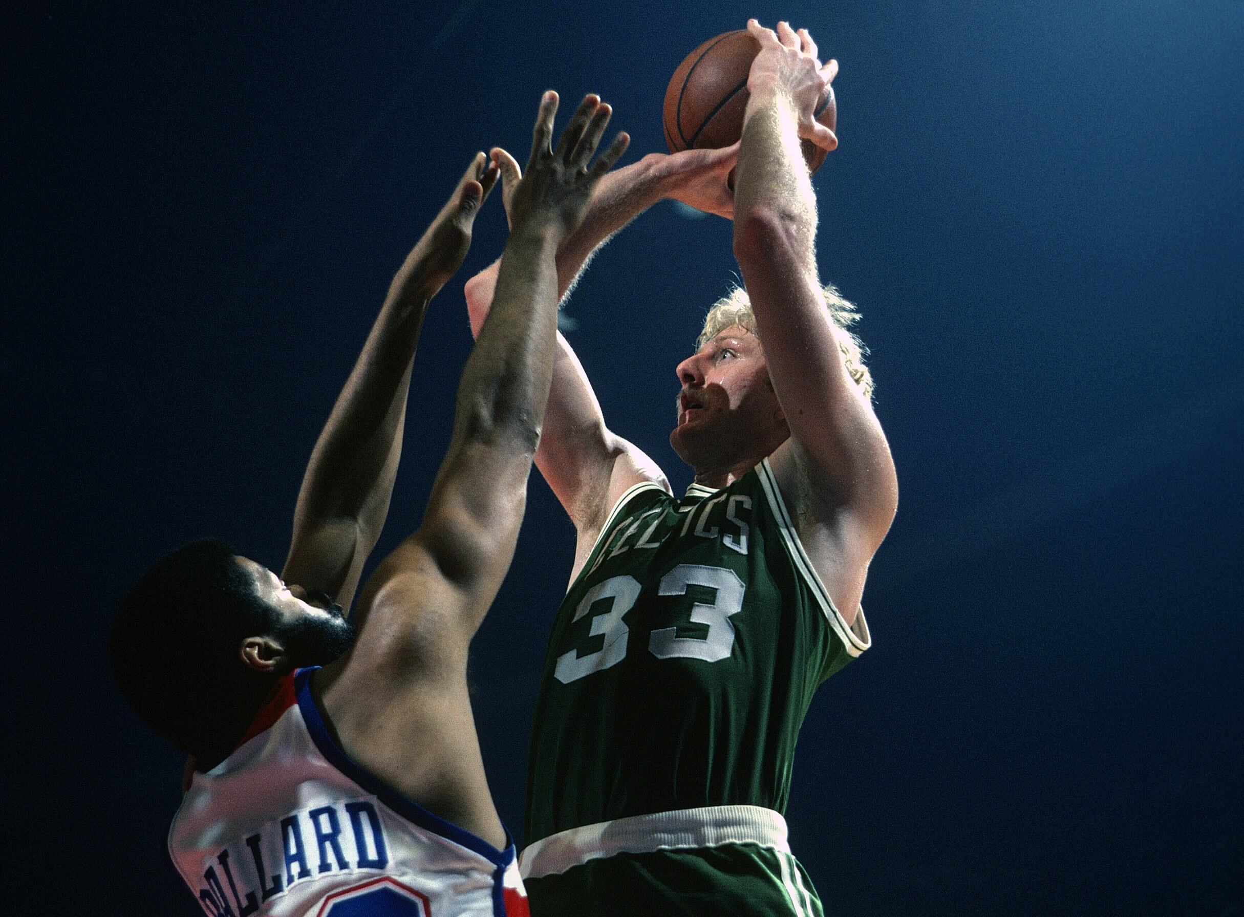 Larry Bird Boston Celtics Unsigned with Magic Johnson Celtics Shirt  Photograph