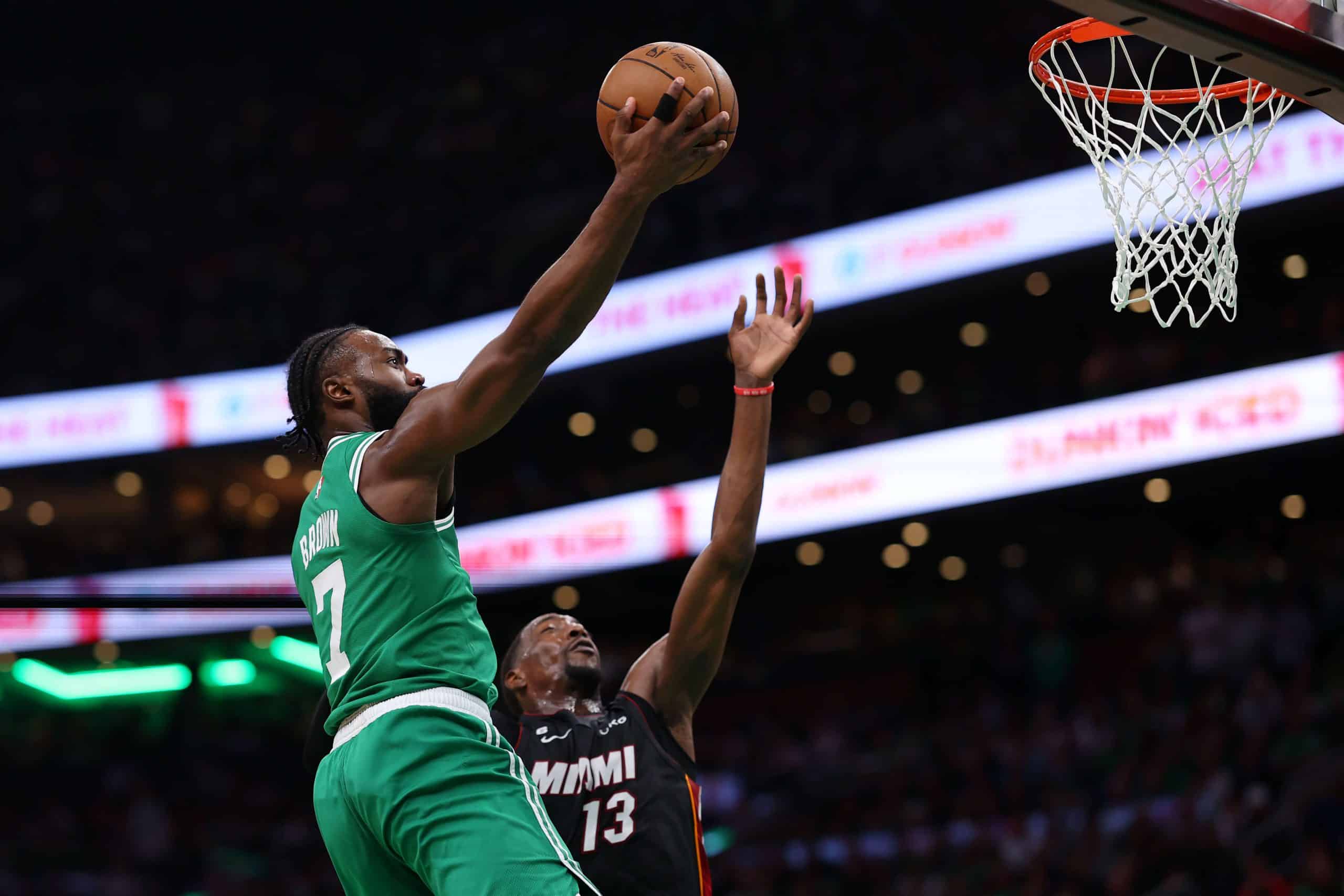 Jaylen Brown of the Boston Celtics drives to the basket against Bam Adebayo of the Miami Heat.