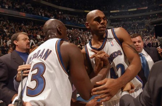 Jerry Stackhouse of the Washington Wizards is congratulated by Michael Jordan of the Wizards for his last-second dunk in 2002