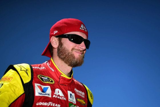 Dale Earnhardt Jr. stands on the grid during qualifying for the 2016 NASCAR Sprint Cup Series Toyota/Save Mart 350