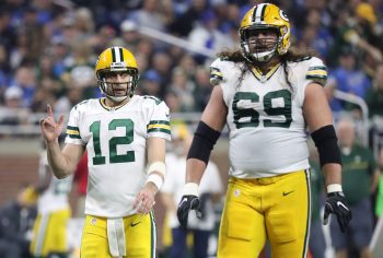 Aaron Rodgers and David Bakhtiari of the Green Bay Packers walk to the line.