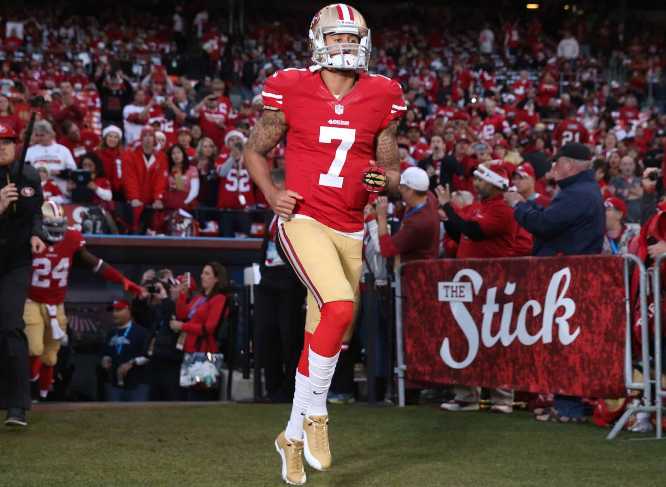 San Francisco 49ers quarterback Colin Kaepernick runs on the field.