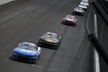 Kyle Larson and Kyle Busch race at Indy.
