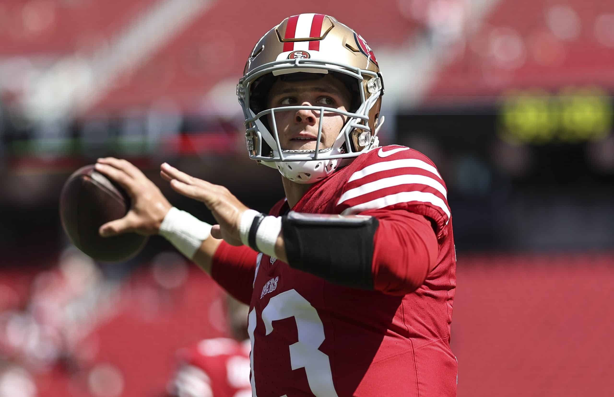 Brock Purdy of the San Francisco 49ers warms up.