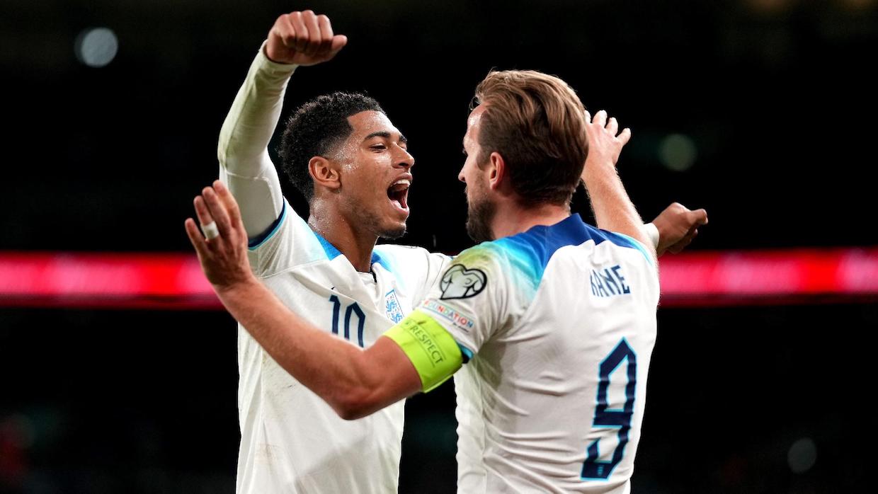 Bellingham and Kane embrace after England's win vs Slovakia