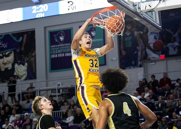 Cooper Flagg dunks a ball.