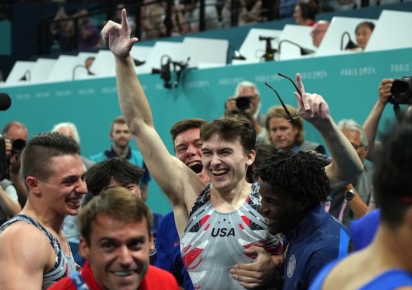 Stephen Nedoroscik reacts with teammates after he performs on the pommel horse.