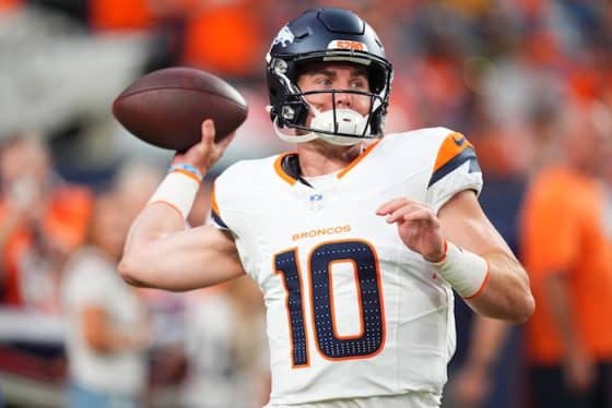 Denver Broncos quarterback Bo Nix warms up in the first quarter.