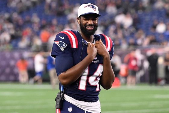 New England Patriots quarterback Jacoby Brissett (14) walks onto the field.