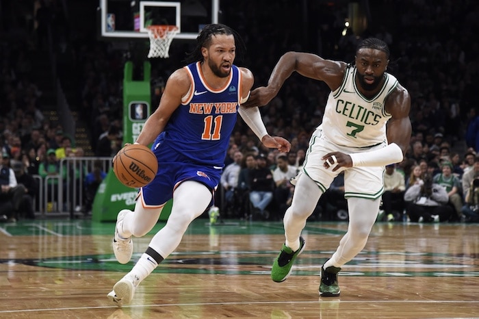 New York Knicks guard Jalen Brunson (11) controls the ball while Boston Celtics guard Jaylen Brown (7).