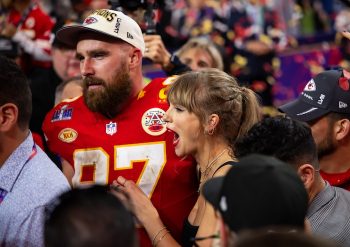 Kansas City Chiefs tight end Travis Kelce (87) celebrates with girlfriend Taylor Swift.