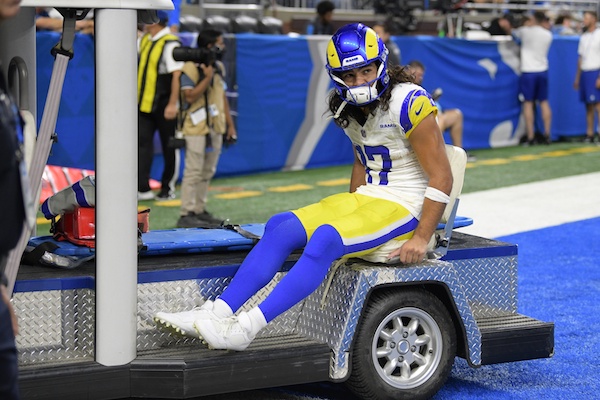 Puka Nacua sits on a medical cart.