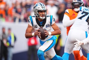 Carolina Panthers quarterback Bryce Young prepares to pass the ball.