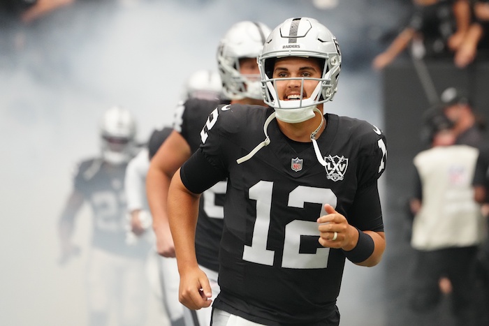 Las Vegas Raiders quarterback Aidan O'Connell (12) takes the field.