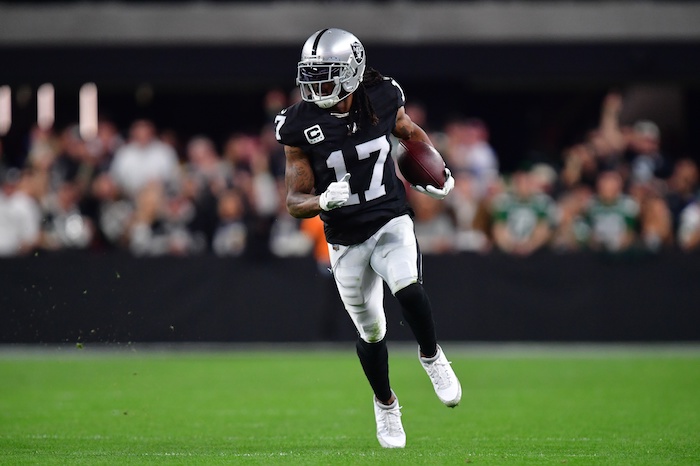 Las Vegas Raiders wide receiver Davante Adams (17) runs the ball.