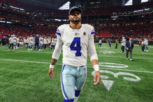 Dallas Cowboys quarterback Dak Prescott walks off the field.